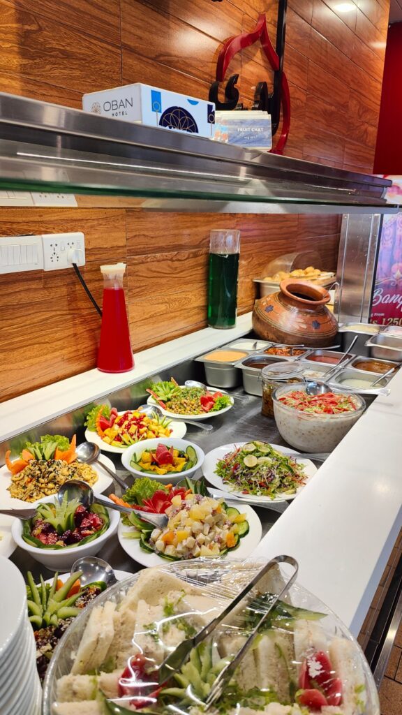 A close-up view of colorful Lahore salads and chutneys.